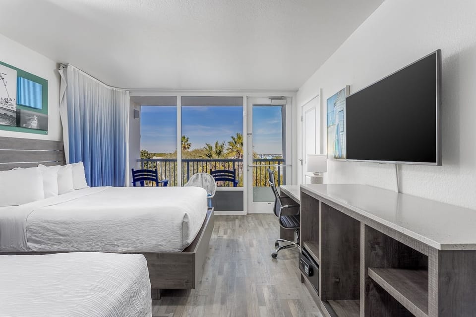 Stretch out in airy comfort with balcony light streaming in.