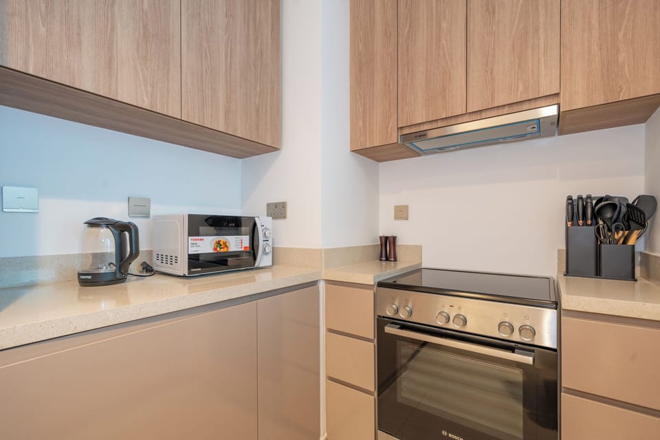 Apartment, Balcony, City View | Private kitchen | Espresso maker, electric kettle