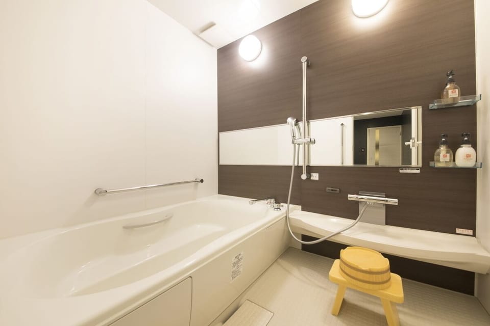 Superior Room | Bathroom | Hair dryer, slippers, towels, toilet paper