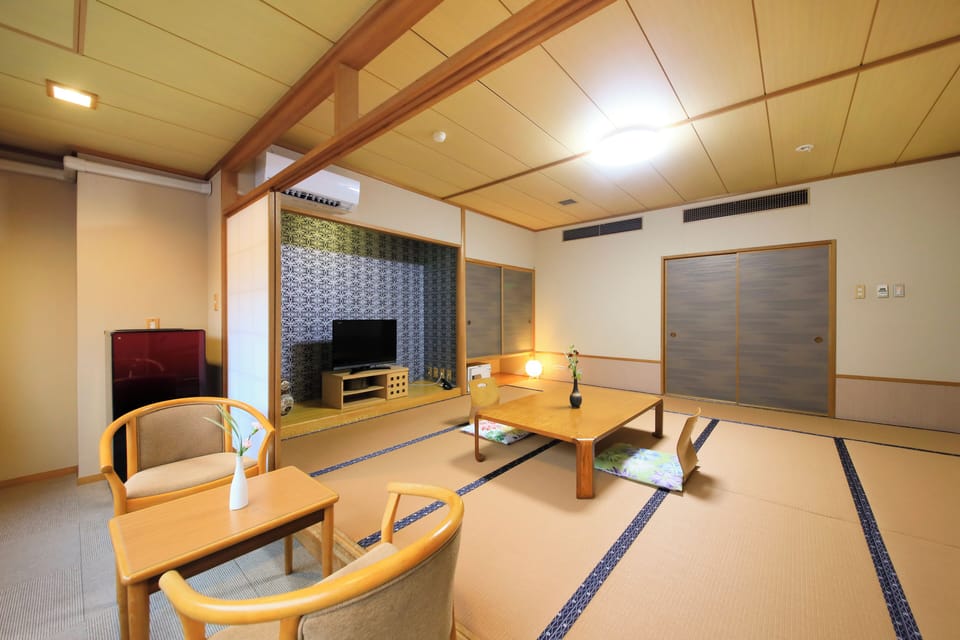 Basic Quadruple Room, Non Smoking, Garden View | In-room safe, iron/ironing board (on request), WiFi (free), bed sheets