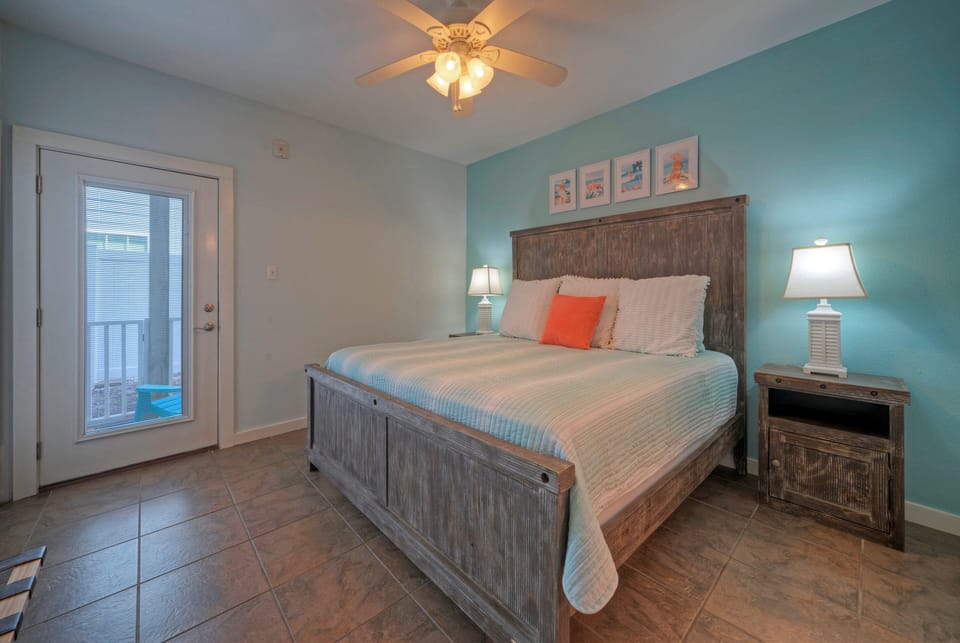 The primary bedroom features a king bed, TV and an ensuite bathroom (Unit 109)