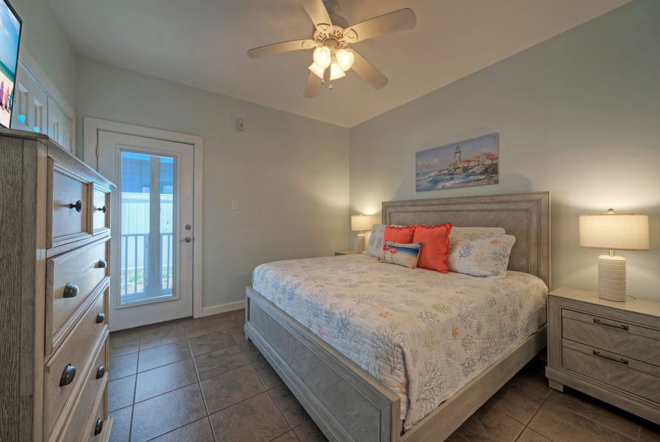 Primary bedroom features a king bed and ensuite bathroom (Unit 107)