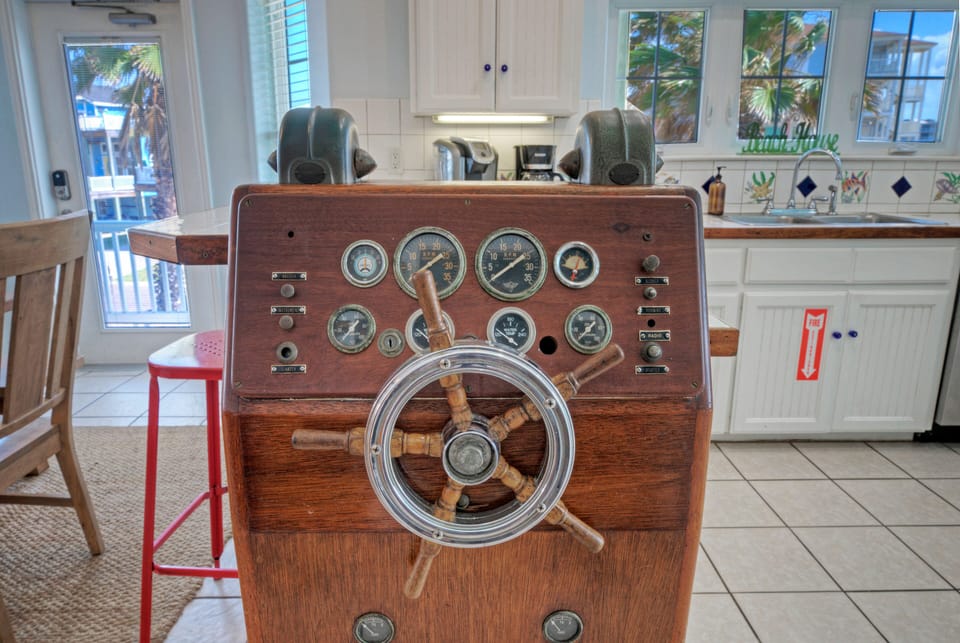 Vintage ship’s wheel console.