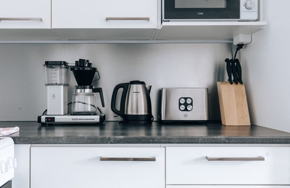 The apartment`s kitchen is well-equipped and includes an oven, full-size fridge-freezer, stove, and dishwasher.