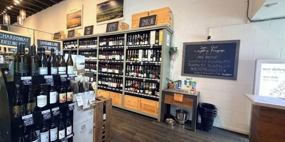 New District Wine Beer & Spirits - 7 minutes away by foot
