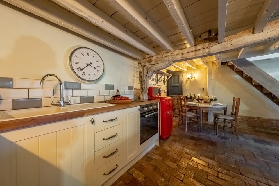 Ground floor: Kitchen area with dining table and chairs