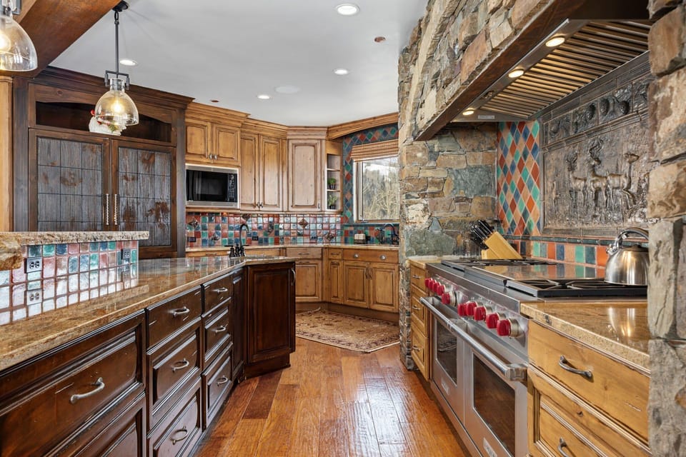 a view of a chefs over in the large chic kitchen