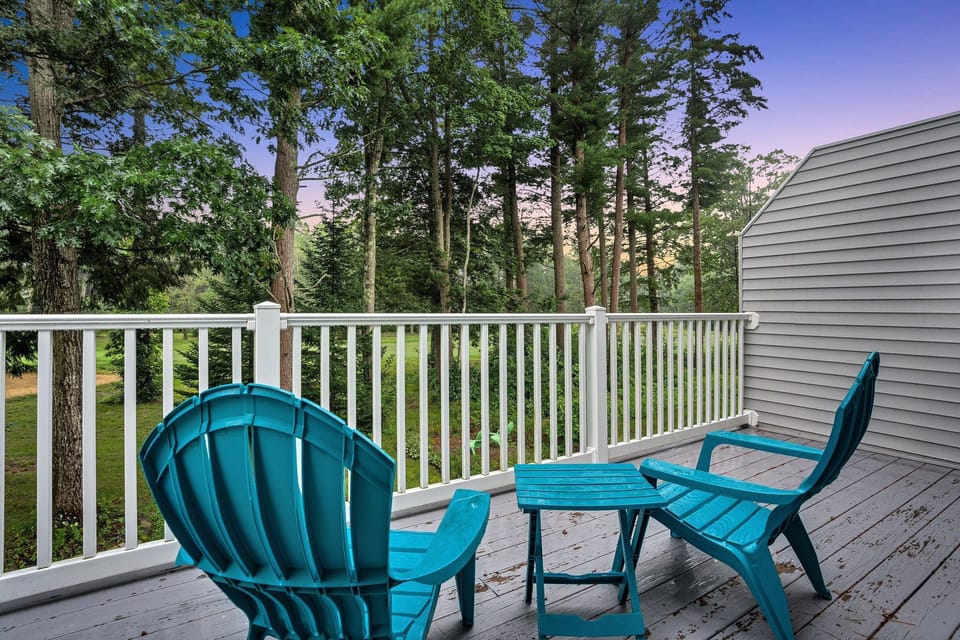 Adirondack chairs on the balcony overlooking the 5th hole