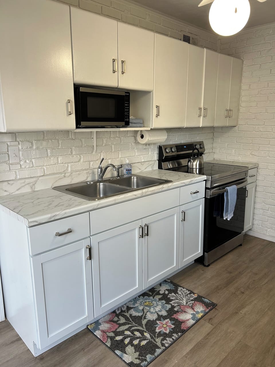 Well stocked kitchen with washer/dryer in pantry