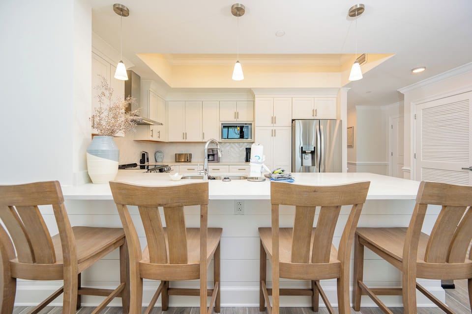 Gather around the sleek kitchen, perfect for morning coffee and enjoying quality time with loved ones