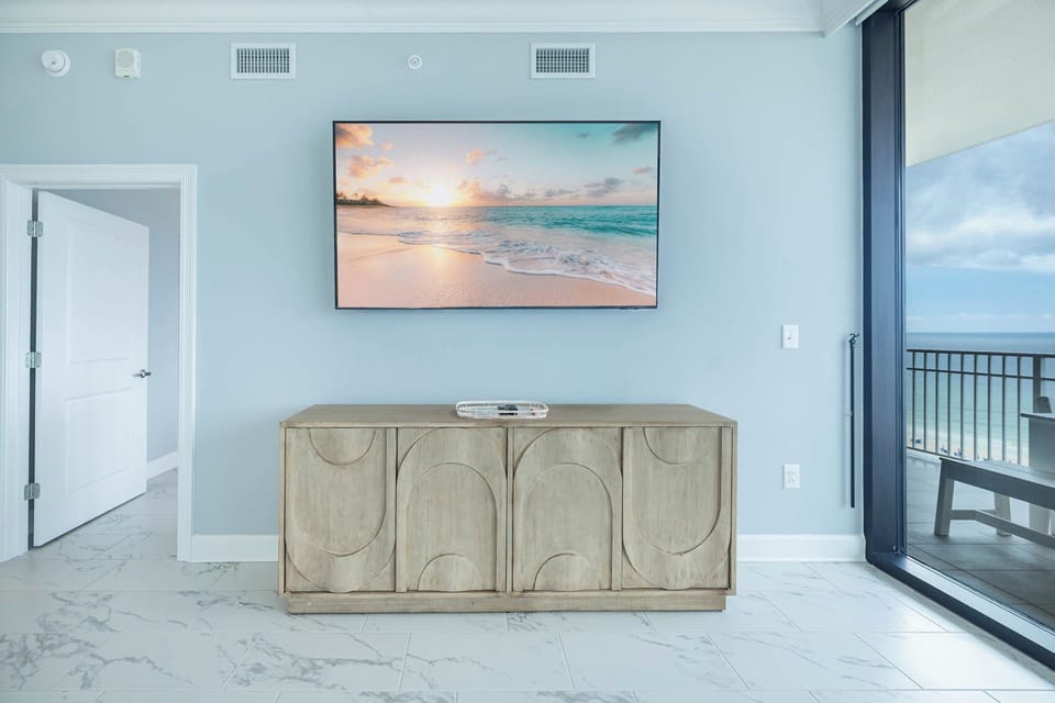Enjoy the serene ambiance with a large TV and stylish cabinet, perfect for streaming your favorite shows