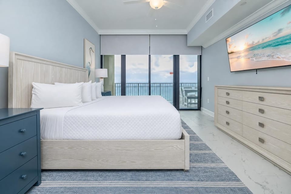 Relax in the master king suite with your favorite shows, elegant decor, and beachfront balcony access
