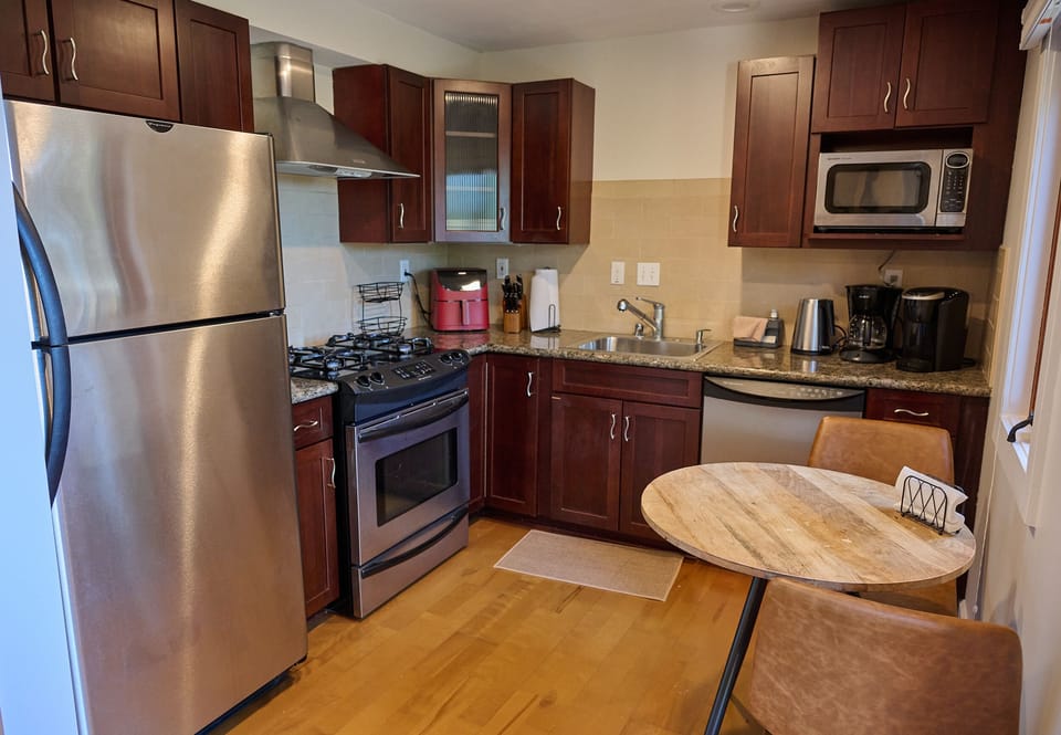 Air fryer, drip coffee maker, Keurig, Brita water pitcher. Coffee, tea, & sugar.
