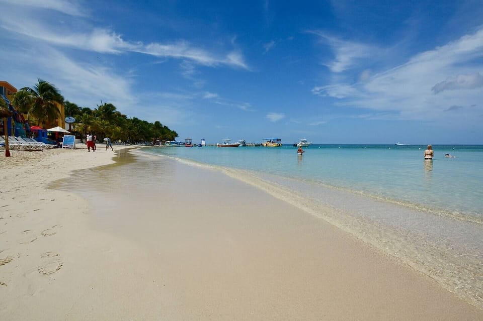 West Bay Beach, just steps from your front deck.