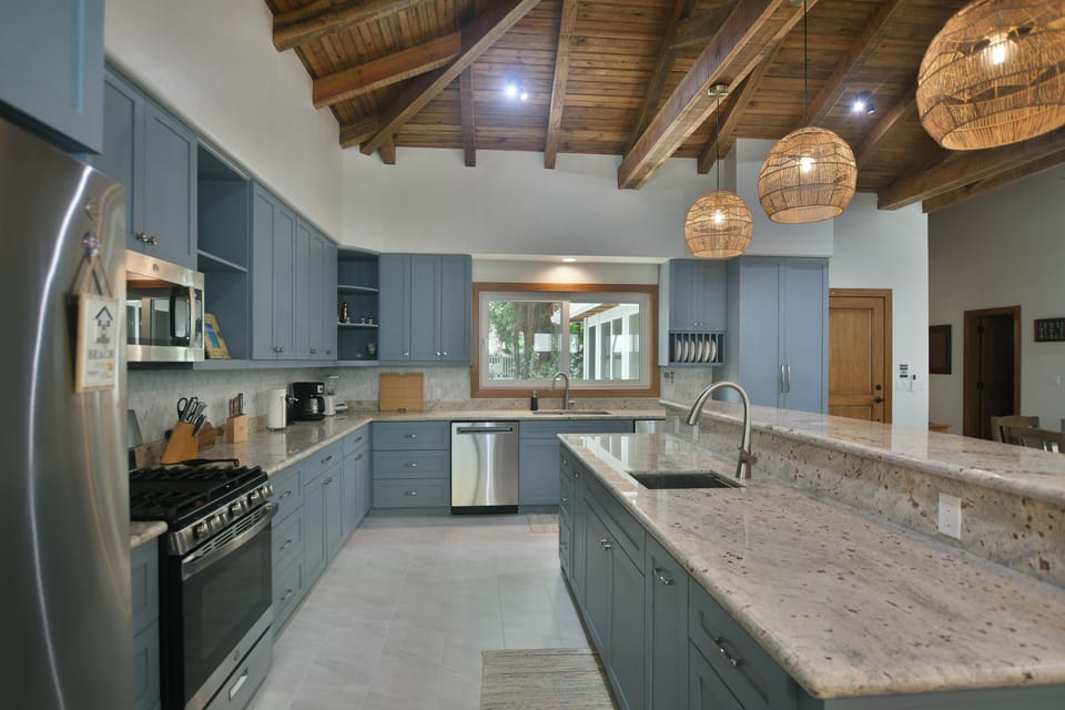 Kitchen with custom cabinets and bar.