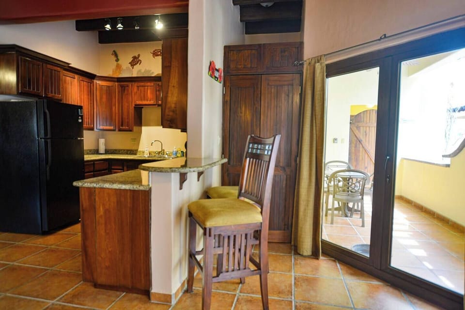 Breakfast bar and doors to balcony