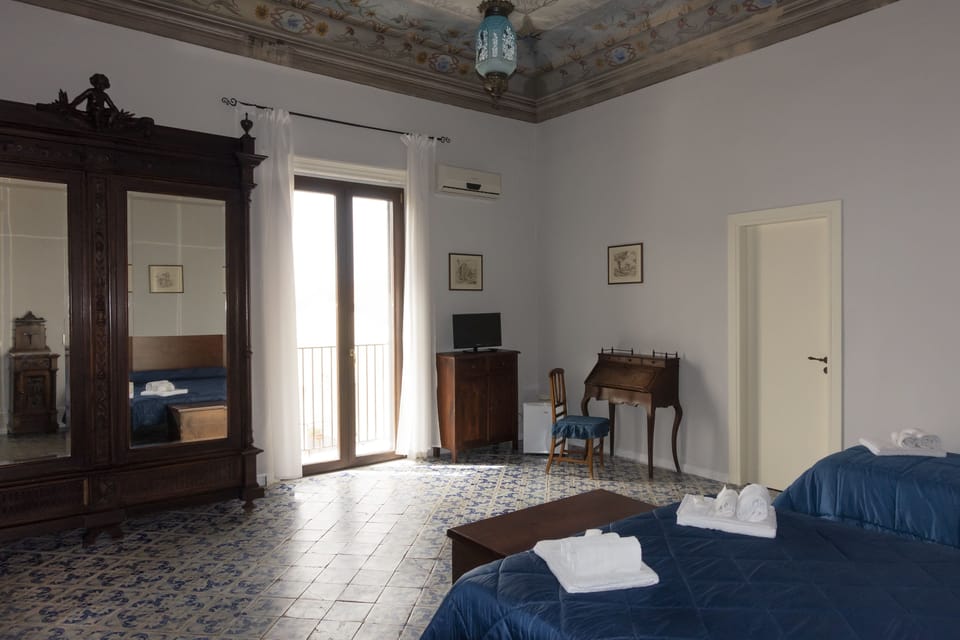 Grand Triple Room, Sea View | 1 bedroom, down comforters, minibar, desk
