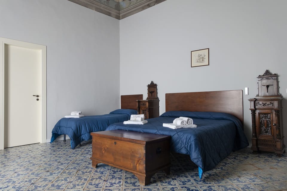 Grand Triple Room, Sea View | 1 bedroom, down comforters, minibar, desk