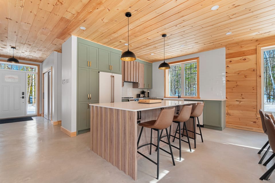 Kitchen with island and entrance view