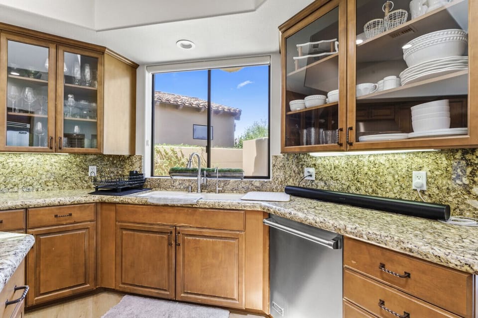 Kitchen corner w/ window views, ample counter space & stainless appliances