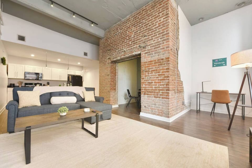 Enjoy a bright and airy living room with chic furnishings and a perfect spot for relaxation.