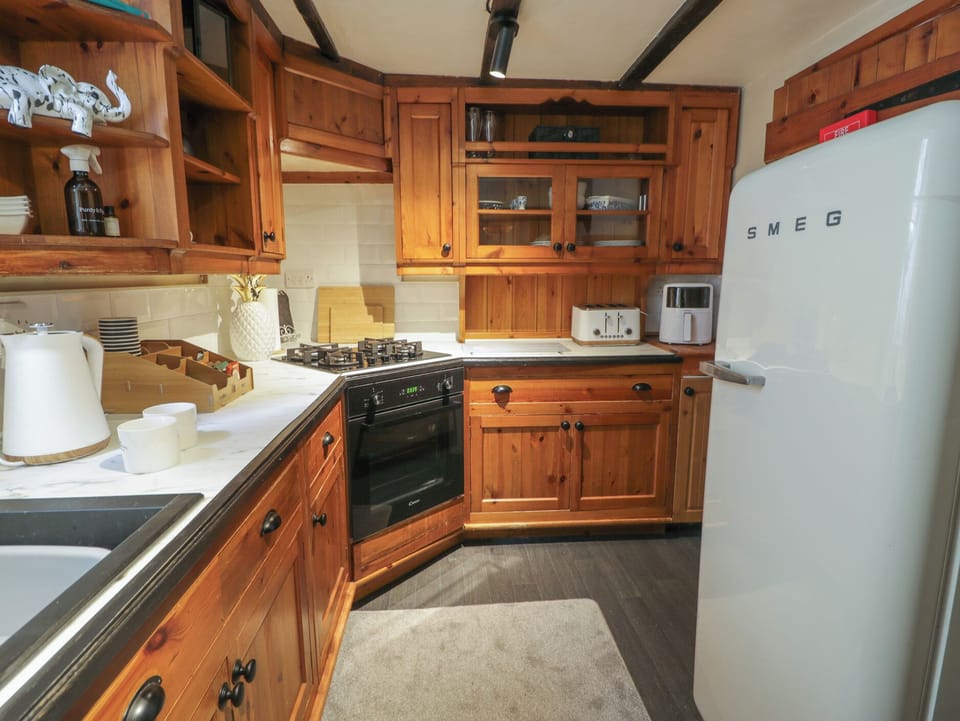 Fridge, microwave, toaster, cookware/dishes/utensils