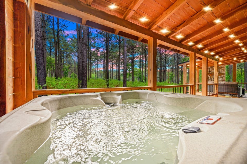 Step outside to soak in your private hot tub under the stars