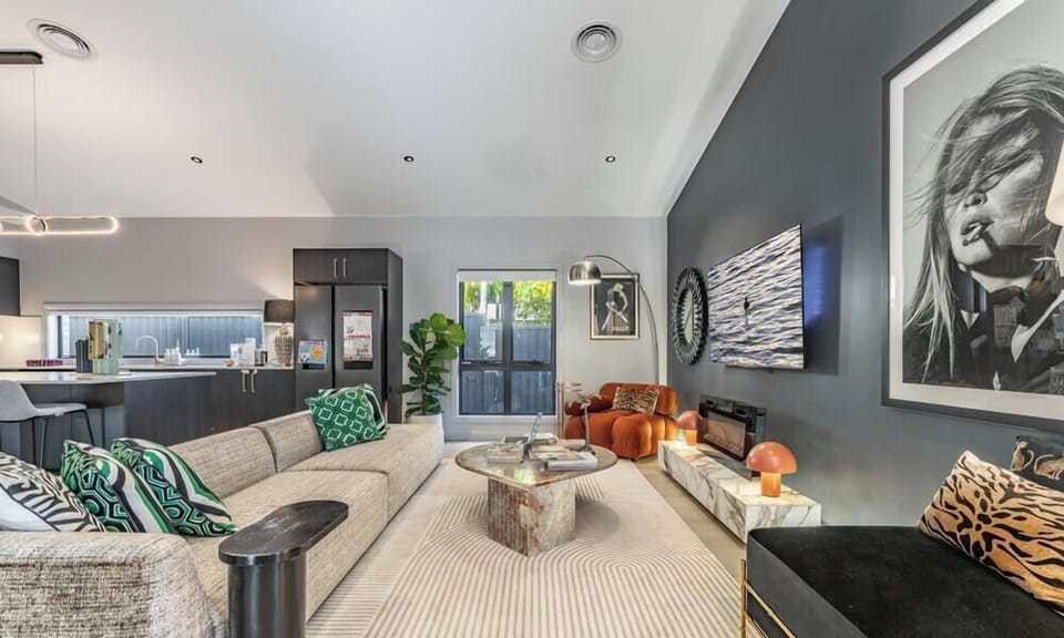 An inviting and contemporary living room featuring plush furniture and sophisticated decor.