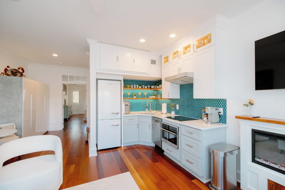 Modern kitchen equipped with high-end finishes, full-size appliances, ice maker, Keurig coffee maker, and everything needed for cooking and entertaining.