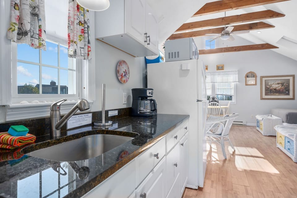 Kitchen with fridge and microwave
