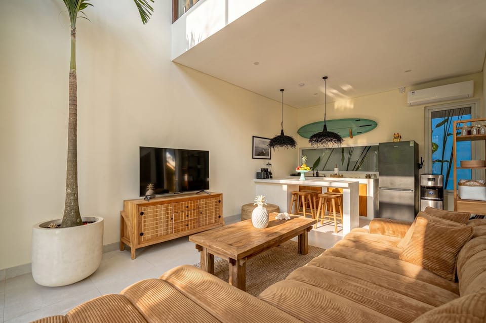 Deluxe Villa, 1 Bedroom, Patio, Pool View | Living room | 50-inch TV with cable channels
