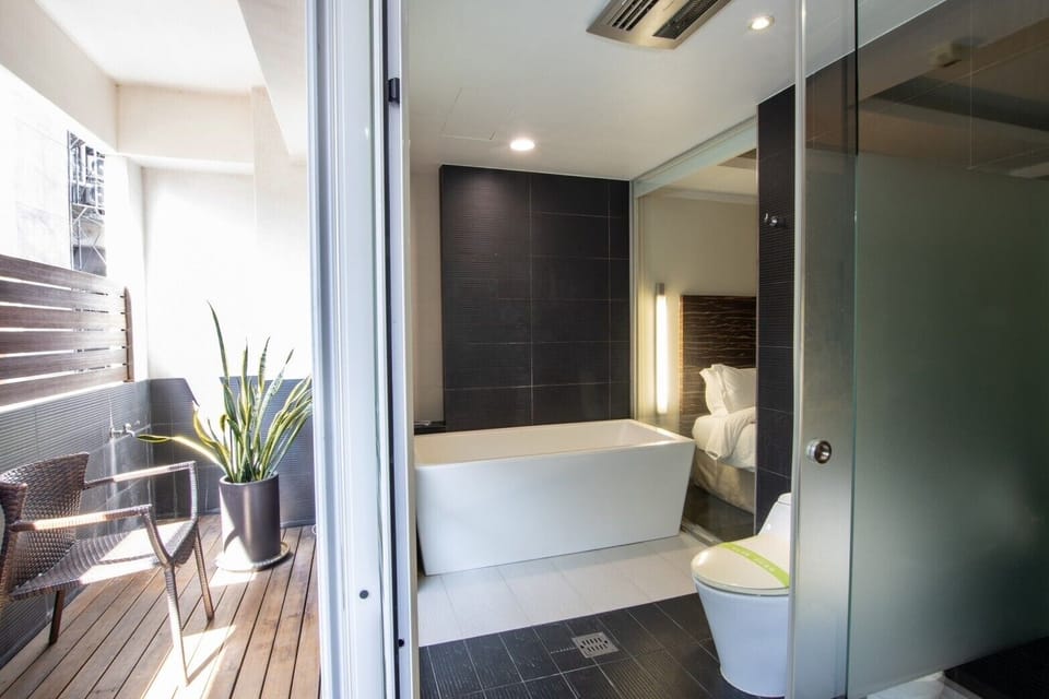 Fashion Quadruple Room | Bathroom | Designer toiletries, hair dryer, slippers, towels
