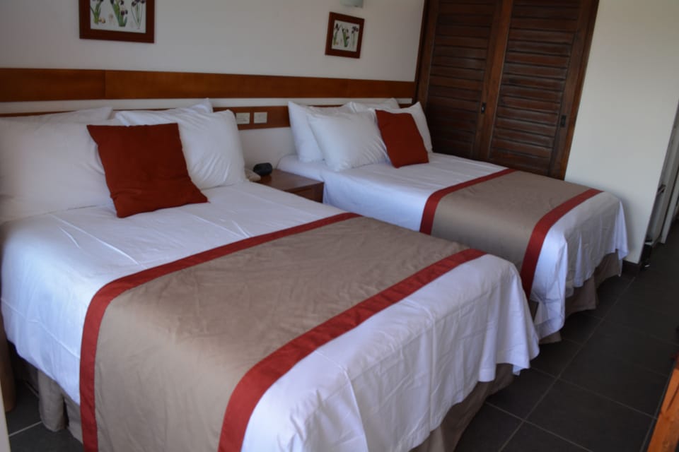 Premium bedding, Tempur-Pedic beds, desk, laptop workspace
