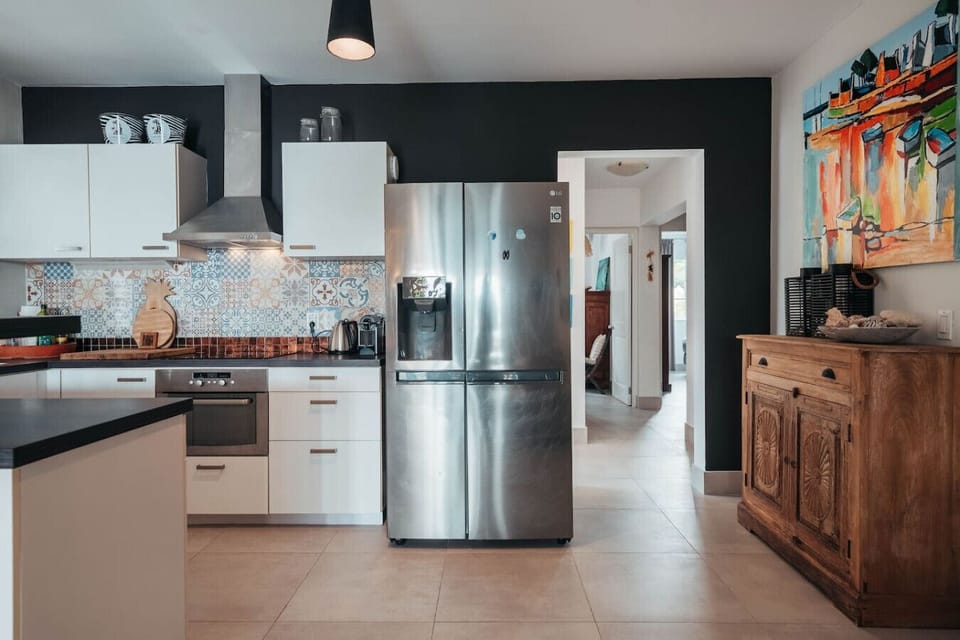 The fully equipped kitchen includes full-size appliances, ample counter space, and everything you need to prepare meals, snacks, or drinks during your stay.