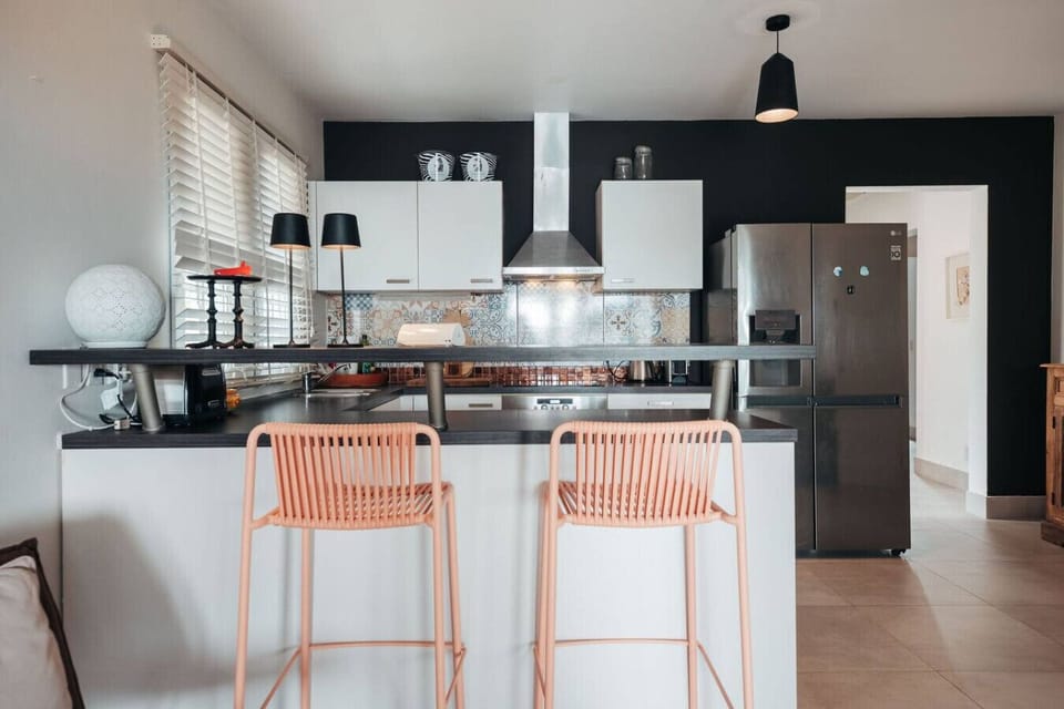A complete kitchen setup highlighted by a spacious countertop, ideal for cooking, dining, and bringing people together.