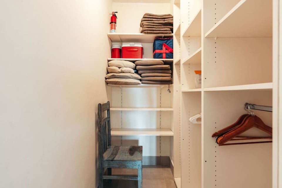 Bedroom 1 features a spacious clothing storage area, offering ample room to keep wardrobes organized and the space clutter-free.
