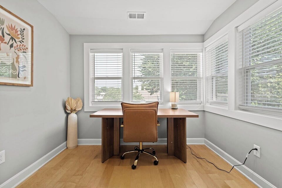 Second floor primary bedroom with sunroom/work space