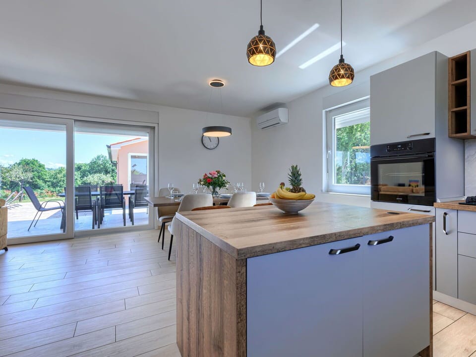 Furniture, Flooring, Interior Design, Countertop, Wood, Floor, Kitchen, Ceiling, Home, Cabinetry