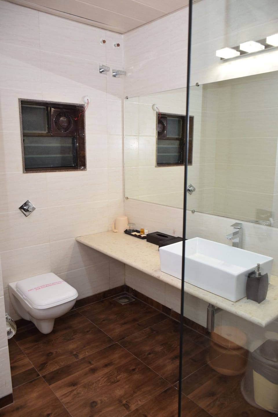 Shower, designer toiletries, towels