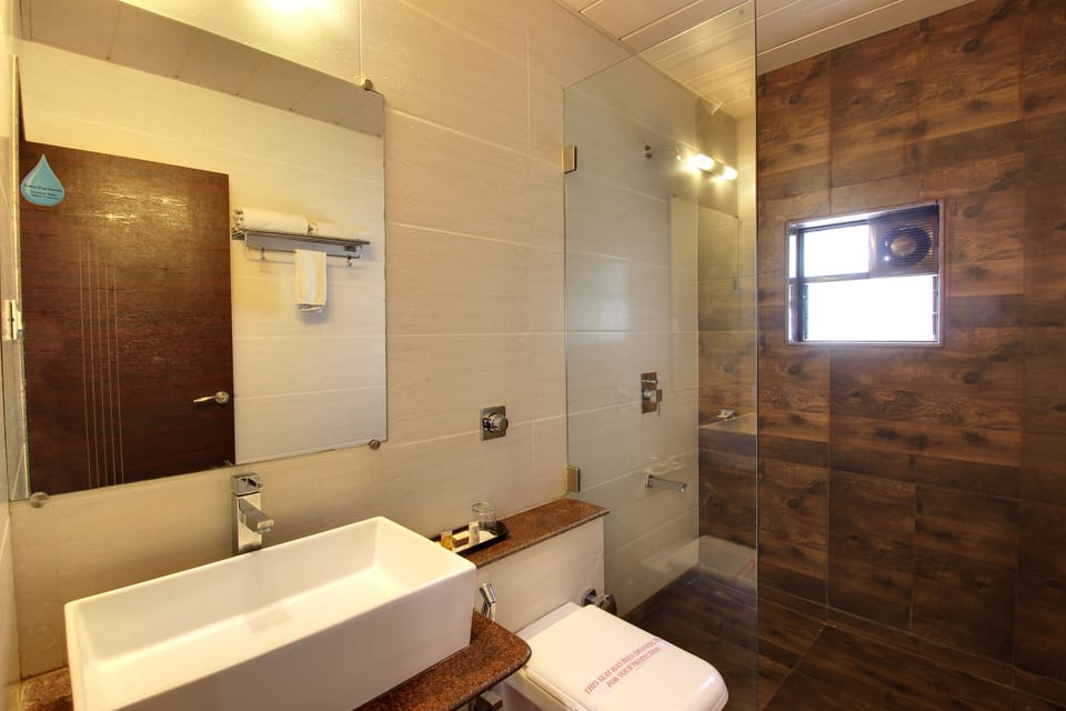 Sai Grand Room (Royale Family Room) Complimentary Shuttle Pick Up & Drop To Sai Baba Temple (Gate-3) | Bathroom | Shower, designer toiletries, towels