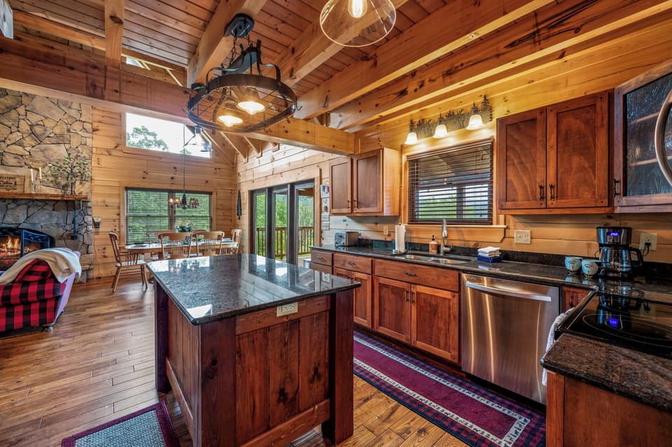 Beautiful kitchen with granite countertops, an island and everything you need for cooking.