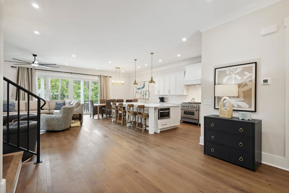 The open-concept living area flows effortlessly into the kitchen and dining space, creating a perfect gathering spot for everyone.