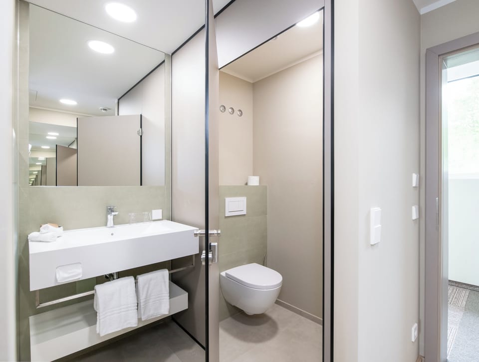 Comfort Double Room, Balcony, Lake View | Bathroom | Shower, rainfall showerhead, hair dryer, bathrobes