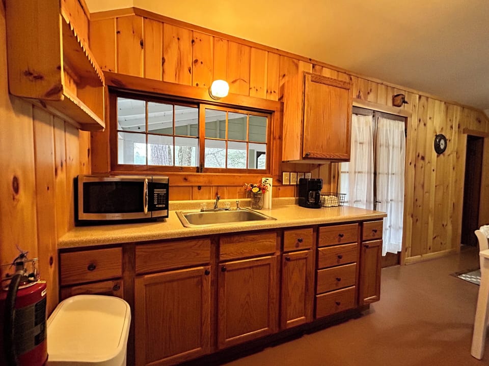 A microwave, a toaster, a coffee maker, and a stove are available.
