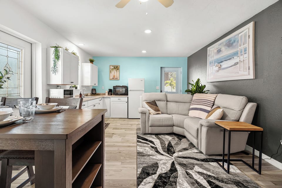 A separate apartment space is located through the laundry room on the other side of the house! There is another living area, TV, small dinette and kitchen space, and Bedroom 3.