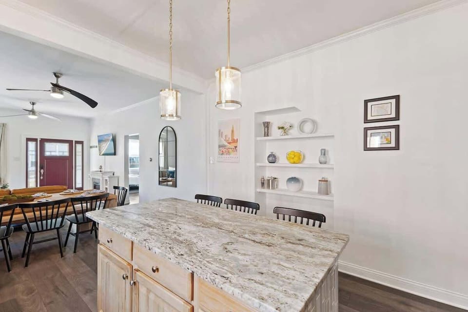 This spacious island is the center of the kitchen allowing extra seating and space for the whole group.