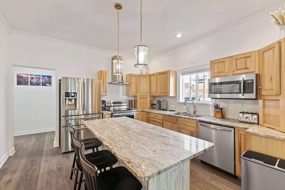 A chef’s dream and a family favorite — this gorgeous kitchen features premium appliances, a spacious island for snacks and stories, and everything you need to whip up delicious memories together. Gather, cook, and savor your Indy stay in style!