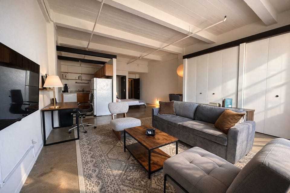 Thoughtfully laid out studio offering flexible, distinct zones for working, dining, and relaxing