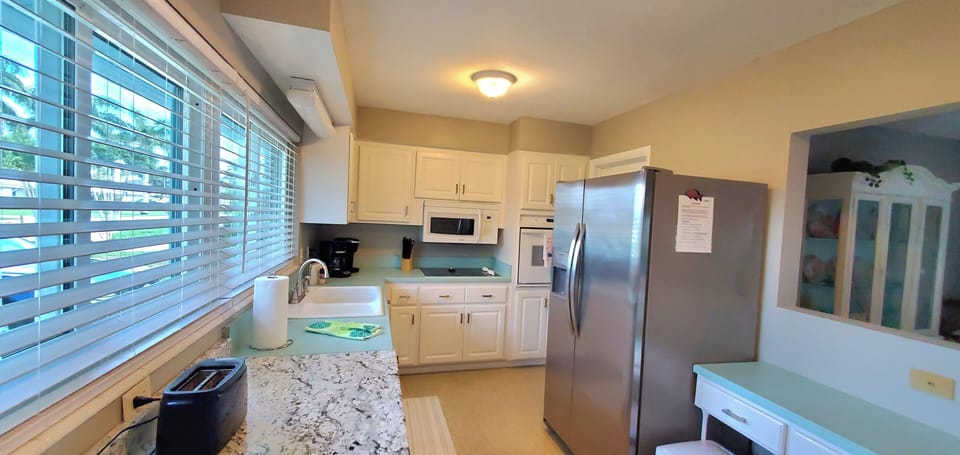 New Refrigerator, electric oven, microwave, and stove