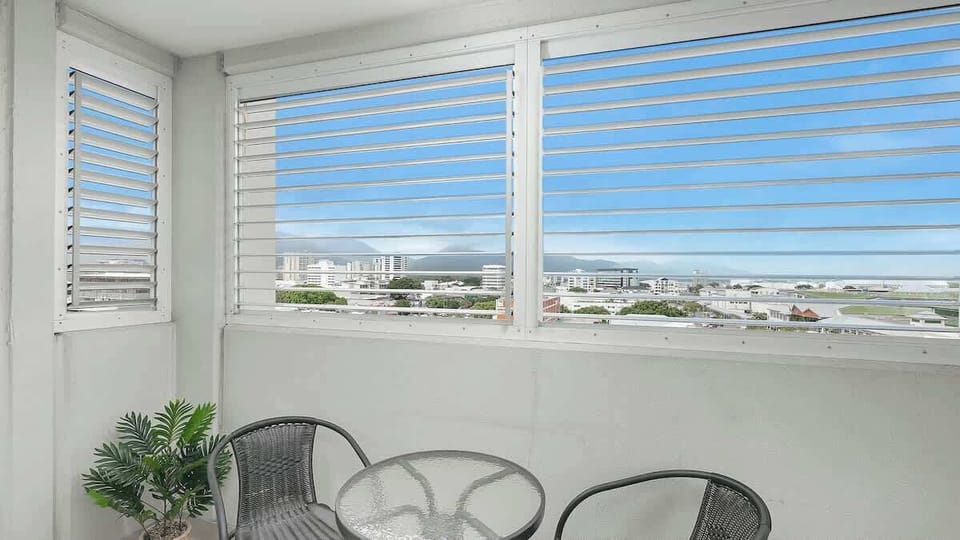 The studio offers an enclosed balcony with elevated views of the city and scenic surrounds.